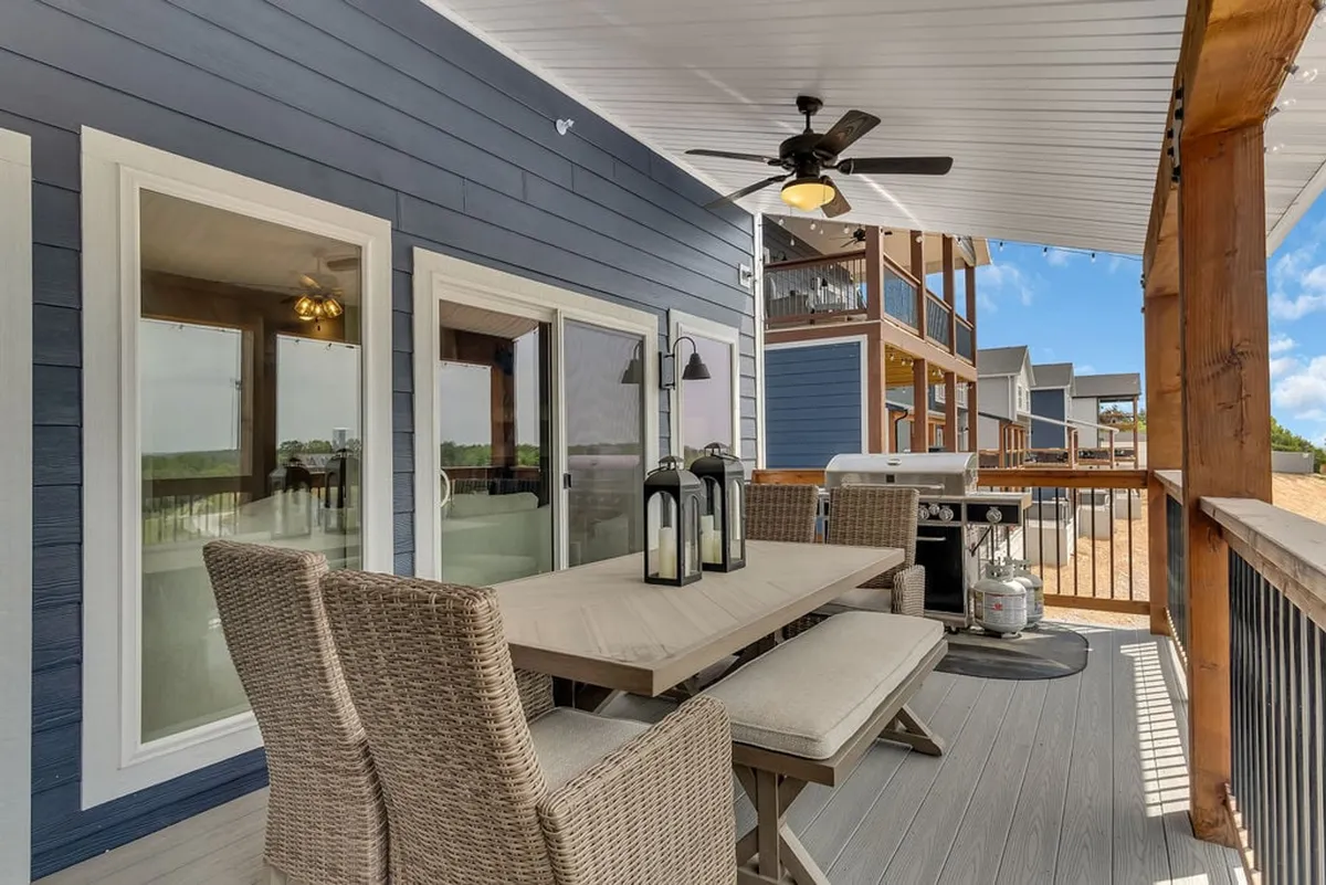 This exterior shot features a spacious patio equipped with a dining table, outdoor seating, a grill, and a beautifully landscaped view. The setup is ideal for sunset dinners, barbecues, and socializing outdoors, capturing the spirit of communal activities mentioned in the section.
